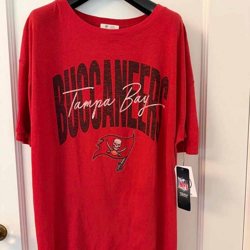 Red Tampa Bay Buccaneers NFL tee with black 'BUCCANEERS' text and Tampa Bay scri